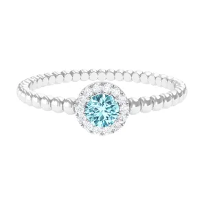 Aquamarine and Diamond Halo Engagement Ring