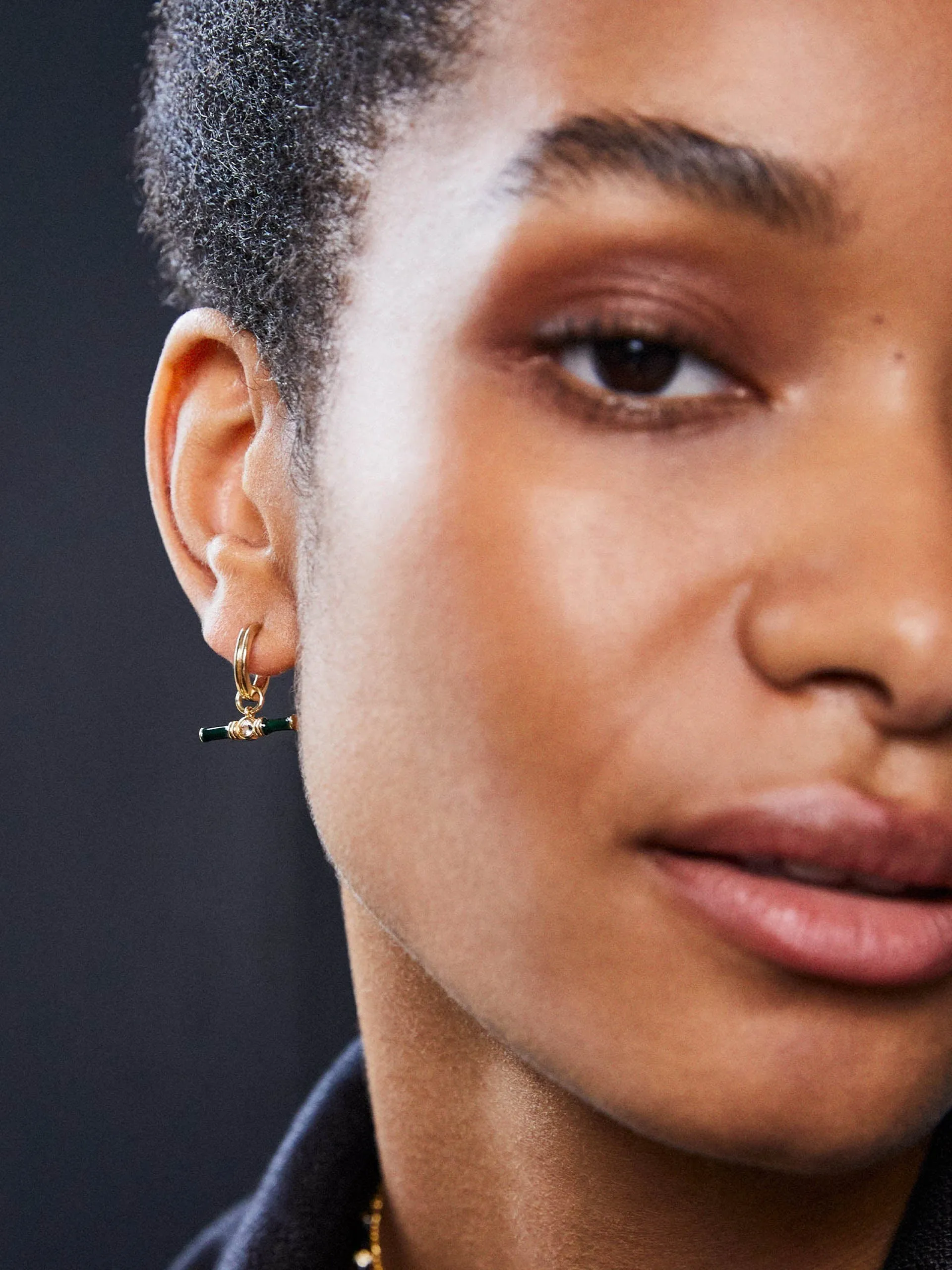 Gold Dyllan hoop earrings with green enamel t-bar charms